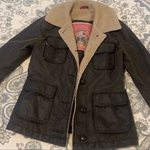 Faux leather jacket with fur collar/cuff detail. Great condition and will last!
